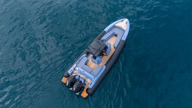 Slide: The Image of 2025 SuperRib Open 30 boat on blue water, aerial view. - 32