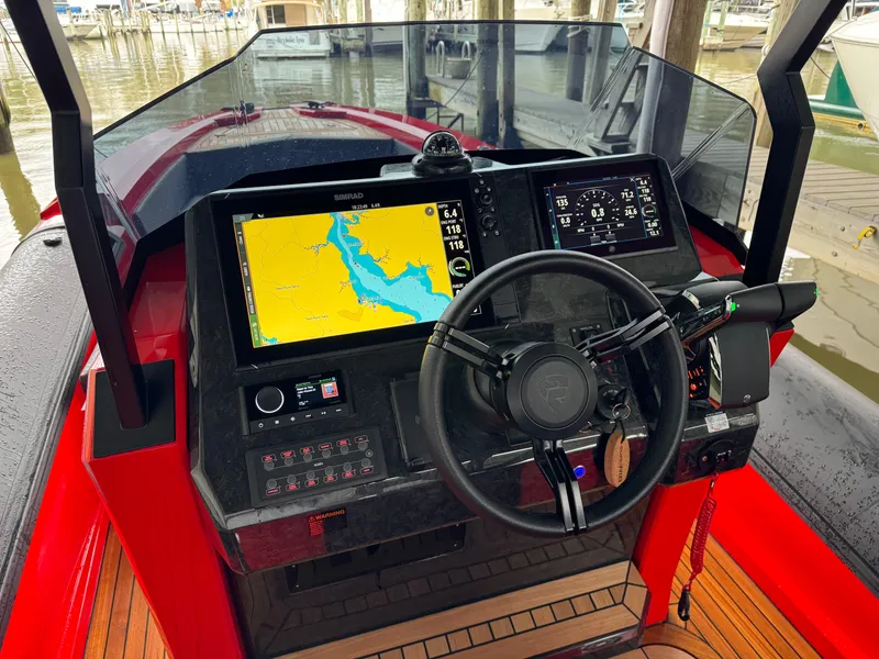 Slide: The Image of Cockpit of 2024 SuperRib Open 30 boat with navigation system and steering wheel. - 4