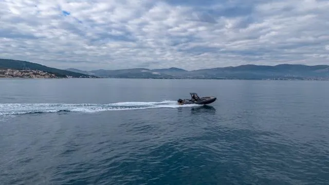 Slide: The Image of 2025 SuperRib Open 30 boat cruising on calm sea under cloudy sky. - 40