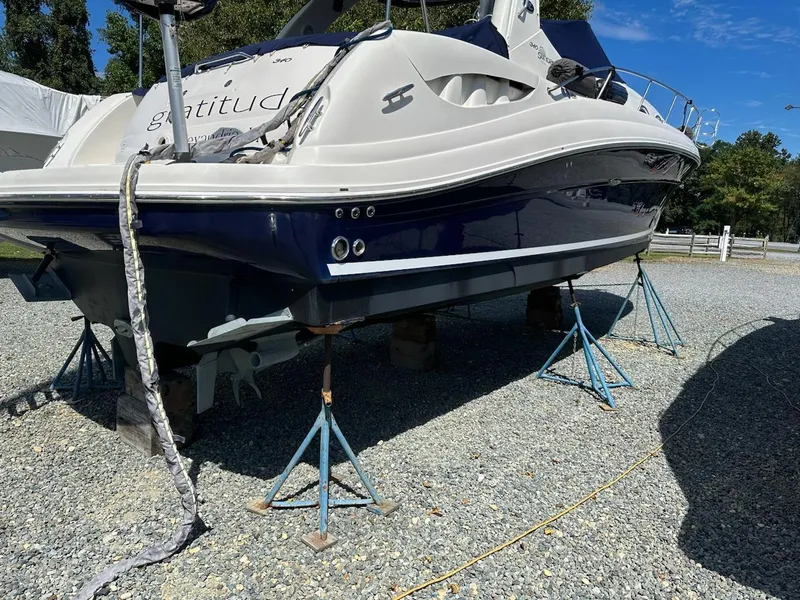 Slide: The Image of 2005 Sea Ray 340 Sundancer boat on stands for maintenance. - 10
