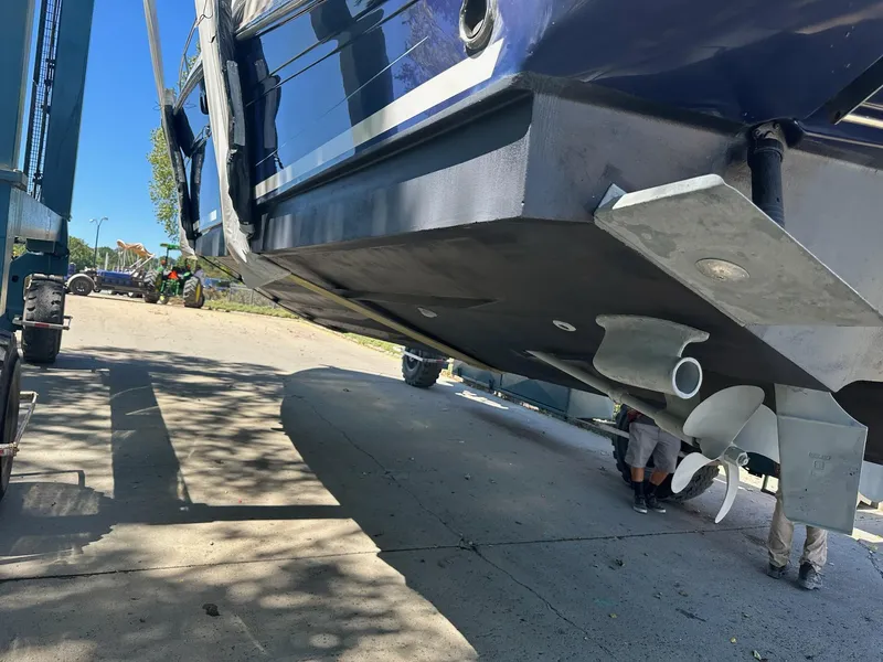Slide: The Image of 2005 Sea Ray 340 Sundancer boat hull and propellers during maintenance. - 11