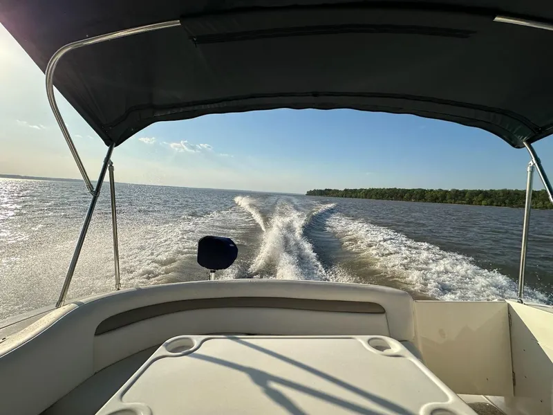 Slide: The Image of View from a 2005 Sea Ray 340 Sundancer boat cruising on open water. - 16