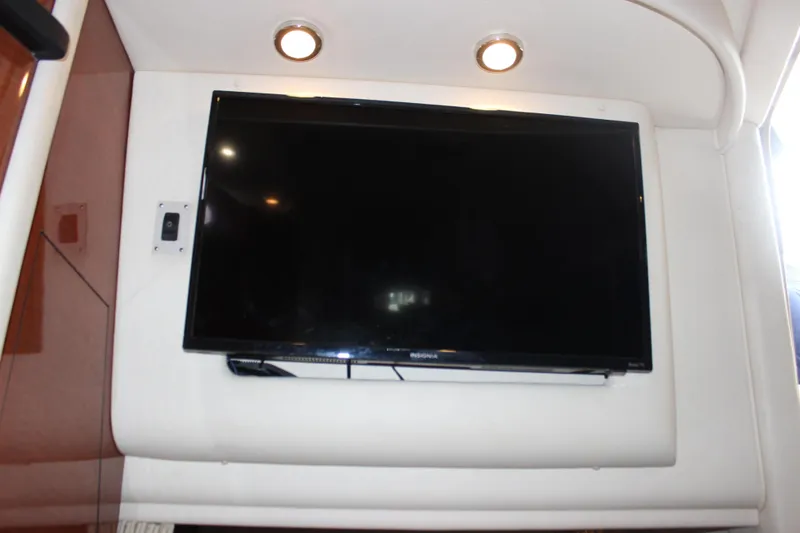 Slide: The Image of Flat-screen TV in the cabin of a 2005 Sea Ray 340 Sundancer yacht. - 18