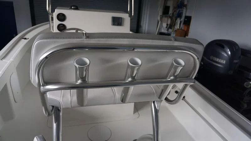 Slide: The Image of 2024 Parker 18 SE CC boat interior with rod holders and Yamaha 90 outboard motor. - 15