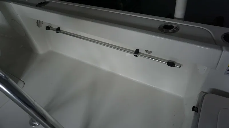 Slide: The Image of Interior view of 2024 Parker 18 SE CC boat showing rod holder and storage area. - 20