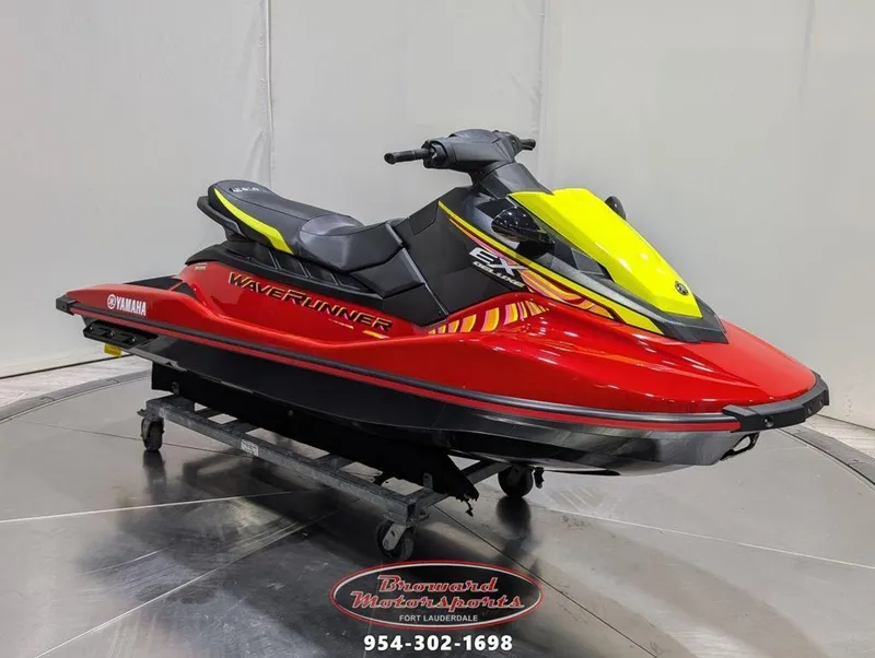 Slide: The Image of 2024 Yamaha EX® Deluxe WaveRunner, red and yellow, displayed at Broward Motorsports. - 1
