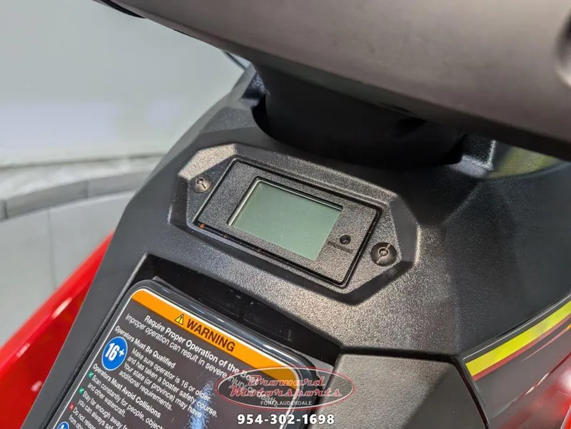 Slide: The Image of Close-up of 2024 Yamaha EX® Deluxe dashboard with warning label. - 12