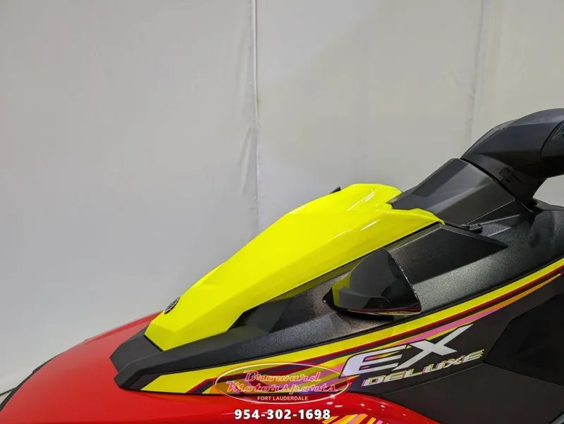 Slide: The Image of 2024 Yamaha EX® Deluxe jet ski, vibrant yellow and red design, side view. - 18