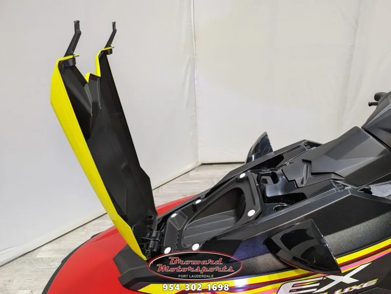 Slide: The Image of 2024 Yamaha EX® Deluxe jet ski with open storage compartment, displayed at Broward Motorsports. - 19