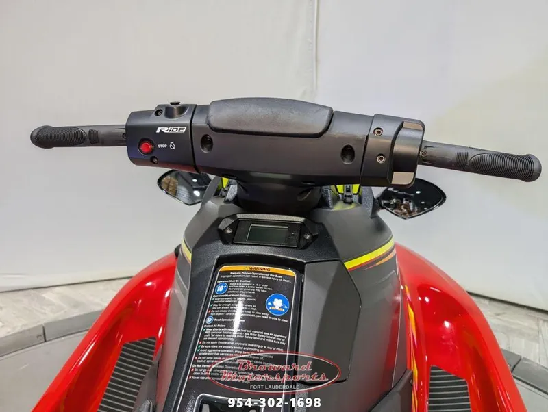 Slide: The Image of 2024 Yamaha EX® Deluxe jet ski handlebars and controls, featuring vibrant red design. - 20