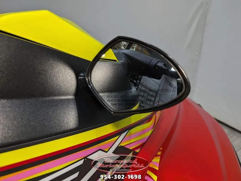 Slide: The Image of 2024 Yamaha EX® Deluxe side mirror with vibrant red and yellow design. - 22