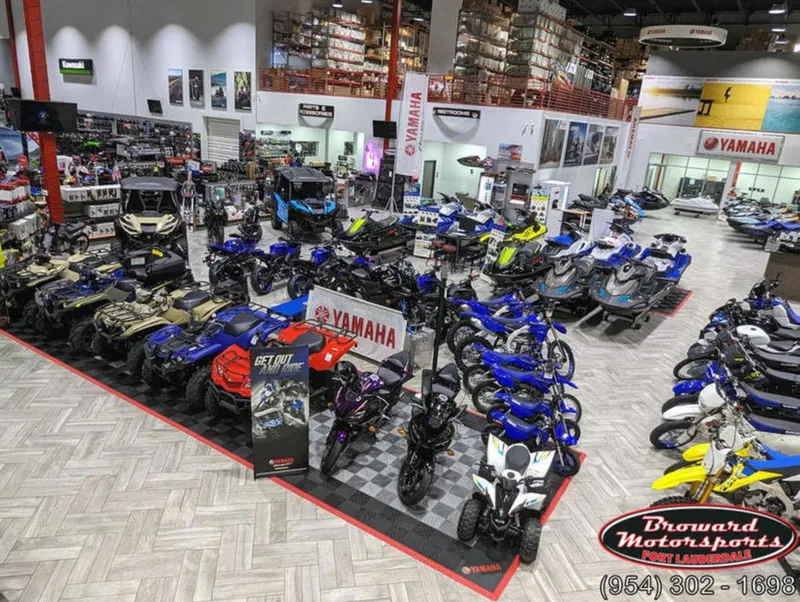 Slide: The Image of Showroom with Yamaha EX® Deluxe 2024 models, motorcycles, and ATVs at Broward Motorsports. - 23