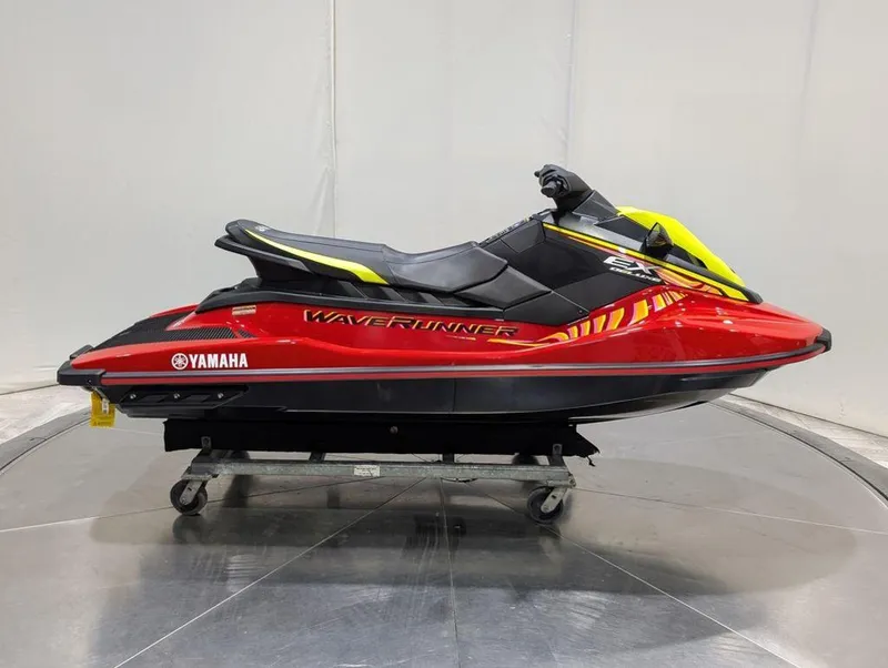 Slide: The Image of 2024 Yamaha Boats EX® Deluxe WaveRunner in red and yellow on display. - 27
