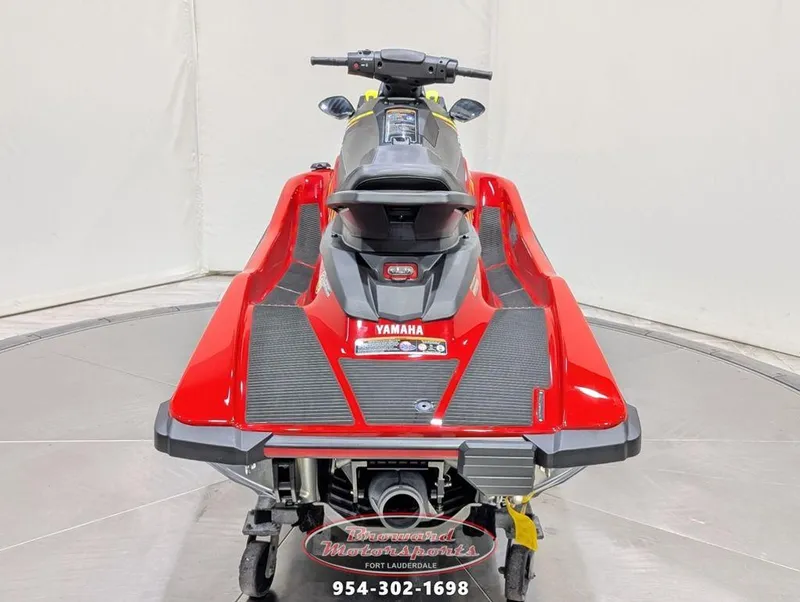 Slide: The Image of 2024 Yamaha EX® Deluxe jet ski, rear view, red and black design. - 6