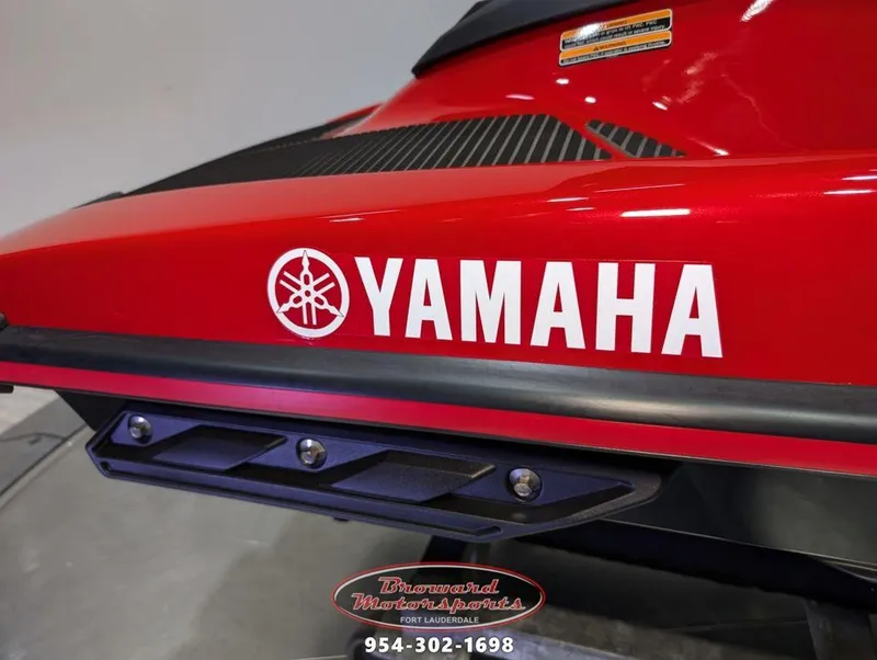 Slide: The Image of 2024 Yamaha EX® Deluxe jet ski, red with logo, Broward Motorsports contact info. - 8