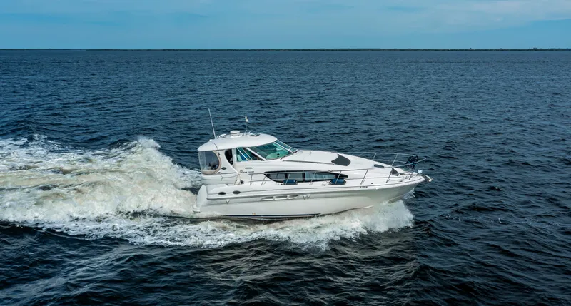 The Image of 2003 Sea Ray 390 Motor Yacht cruising on open water. - 0