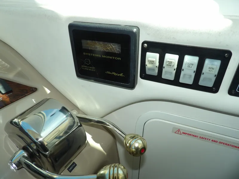 Slide: The Image of Control panel of a 2003 Sea Ray 390 Motor Yacht with system monitor and switches. - 24