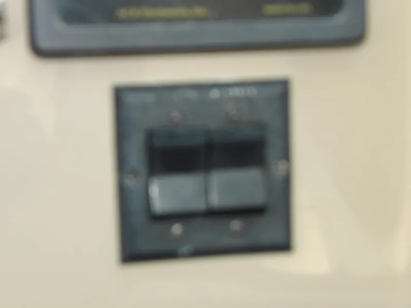 Slide: The Image of Close-up of a control switch on a 2003 Sea Ray 390 Motor Yacht. - 25