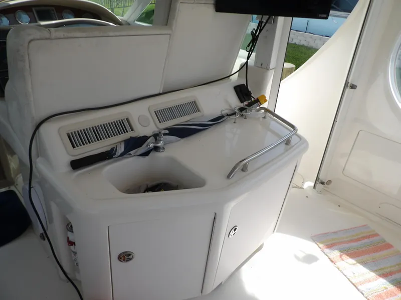Slide: The Image of 2003 Sea Ray 390 Motor Yacht interior sink and counter area. - 29
