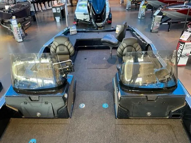 Slide: The Image of 2024 Nitro ZV21 fishing boat interior with dual consoles and seating. - 4