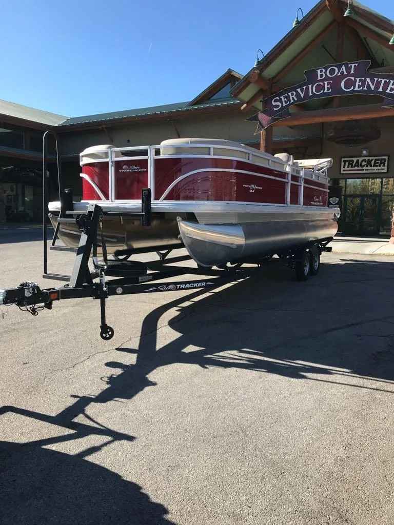 Slide: The Image of 2024 Sun Tracker Party Barge 24 DLX at boat service center. - 5