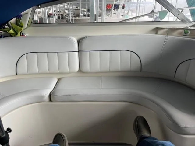 Slide: The Image of Interior seating of a 2000 Rinker 310 Fiesta Vee boat. - 16