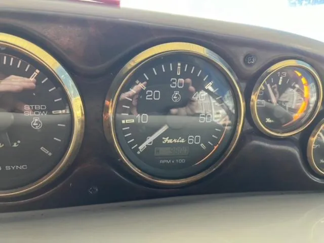 Slide: The Image of Close-up of the dashboard gauges on a 2000 Rinker 310 Fiesta Vee boat. - 29