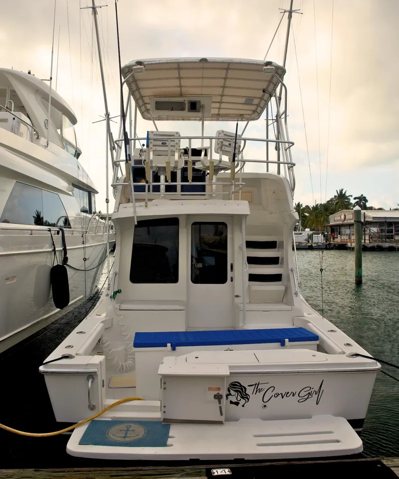 Slide: The Image of 2001 Luhrs 34 Convertible yacht docked at marina. - 0
