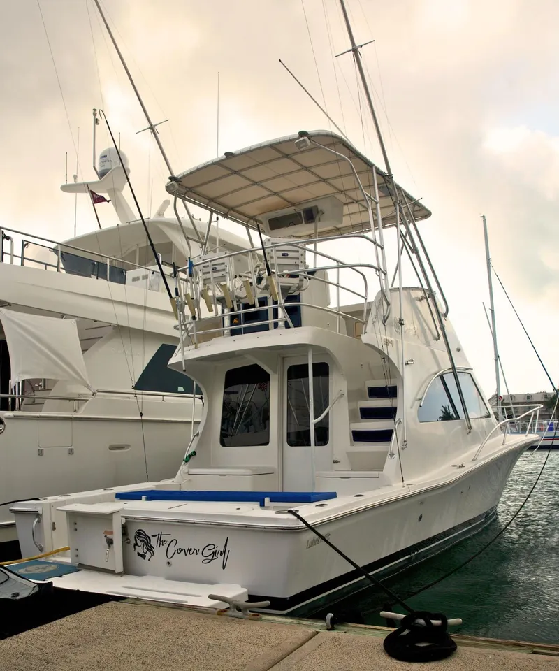 Slide: The Image of 2001 Luhrs 34 Convertible yacht docked at marina. - 1