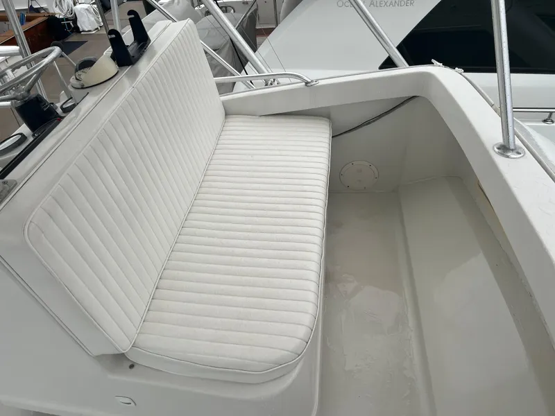 Slide: The Image of 2001 Luhrs 34 Convertible boat with white cushioned seating. - 11