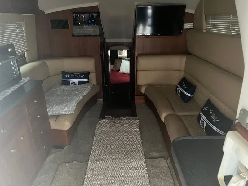 Slide: The Image of Interior of 2001 Luhrs 34 Convertible yacht with beige seating and TV. - 15