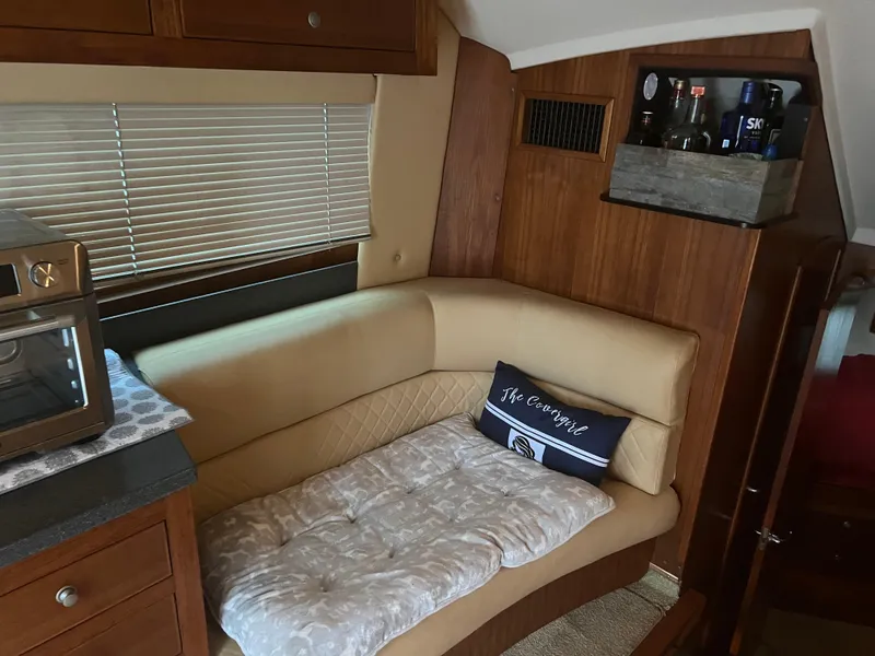 Slide: The Image of Interior of 2001 Luhrs 34 Convertible with beige leather seating and wooden cabinetry. - 17
