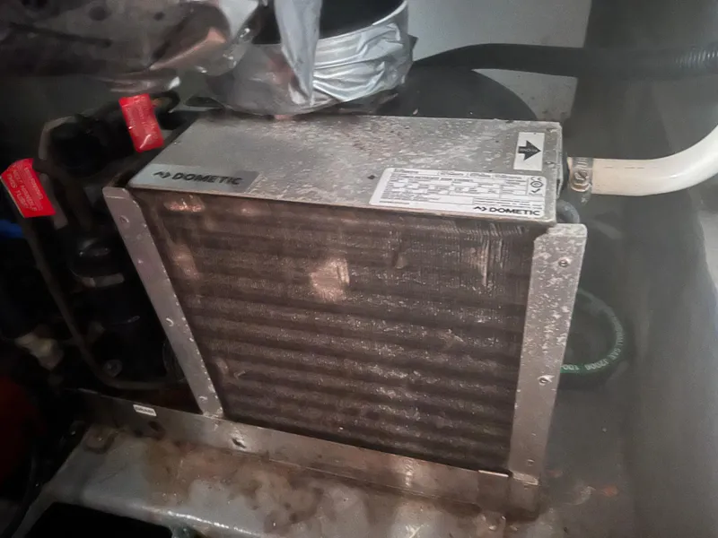 Slide: The Image of Dometic air conditioning unit in a 2001 Luhrs 34 Convertible boat. - 28