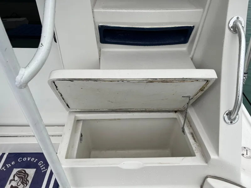 Slide: The Image of Open storage compartment on a 2001 Luhrs 34 Convertible boat. - 7