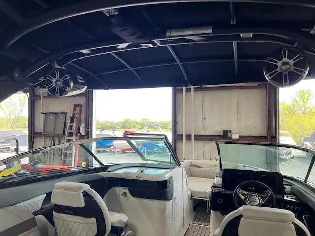 Slide: The Image of Interior of a 2024 Sea Ray SLX 260 boat with modern seating and dashboard. - 12