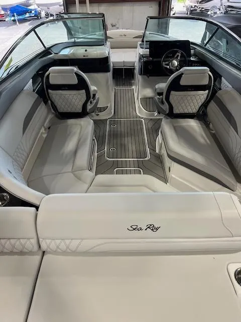 Slide: The Image of 2024 Sea Ray SLX 260 boat interior with luxurious seating and modern dashboard. - 3