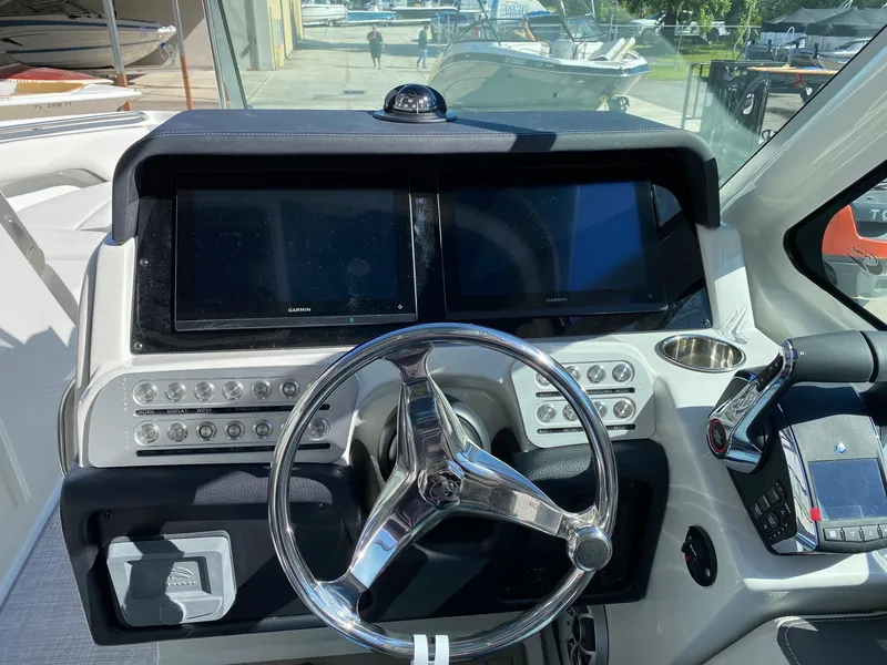 Slide: The Image of 2024 Finseeker 280 DC helm with dual displays and modern controls. - 12