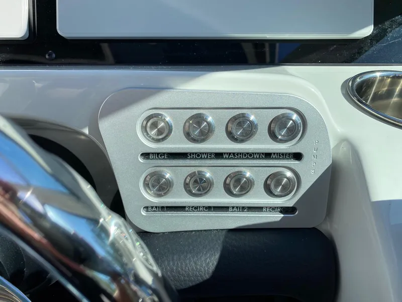 Slide: The Image of Control panel of 2024 Finseeker 280 DC boat with labeled buttons. - 13