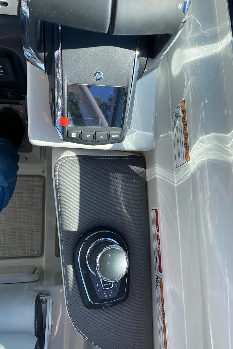 Slide: The Image of 2024 Finseeker 280 DC boat control panel and joystick. - 16