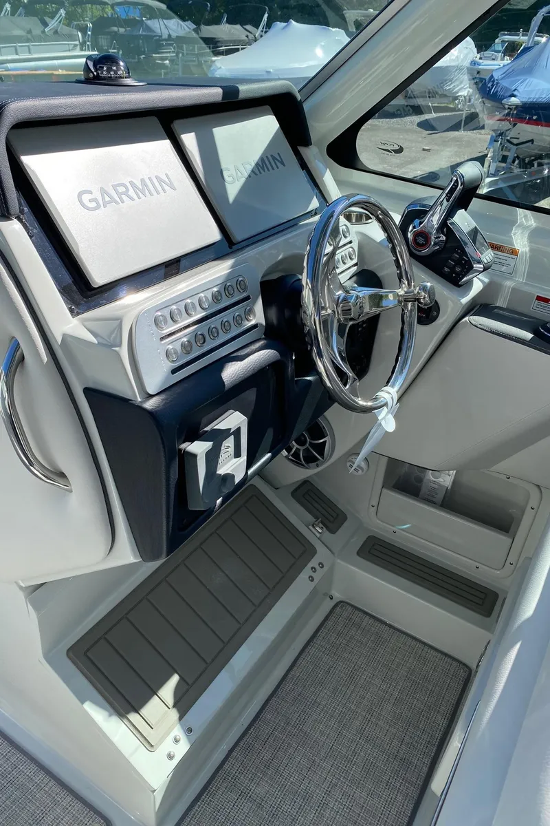 Slide: The Image of 2024 Finseeker 280 DC boat helm with Garmin navigation system. - 18