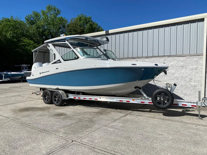 Slide: The Image of 2024 Finseeker 280 DC boat on a trailer outside a storage facility. - 2