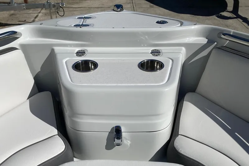 Slide: The Image of 2024 Finseeker 280 DC boat interior with cup holders and seating. - 25