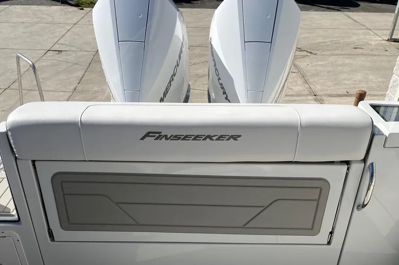 Slide: The Image of 2024 Finseeker 280 DC boat with dual Mercury outboard engines. - 27