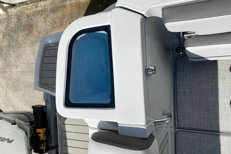 Slide: The Image of 2024 Finseeker 280 DC boat interior with seating and storage compartments. - 30