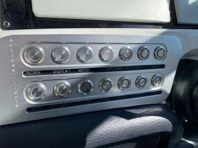 Slide: The Image of Control panel of 2024 Finseeker 280 DC boat with labeled buttons. - 42