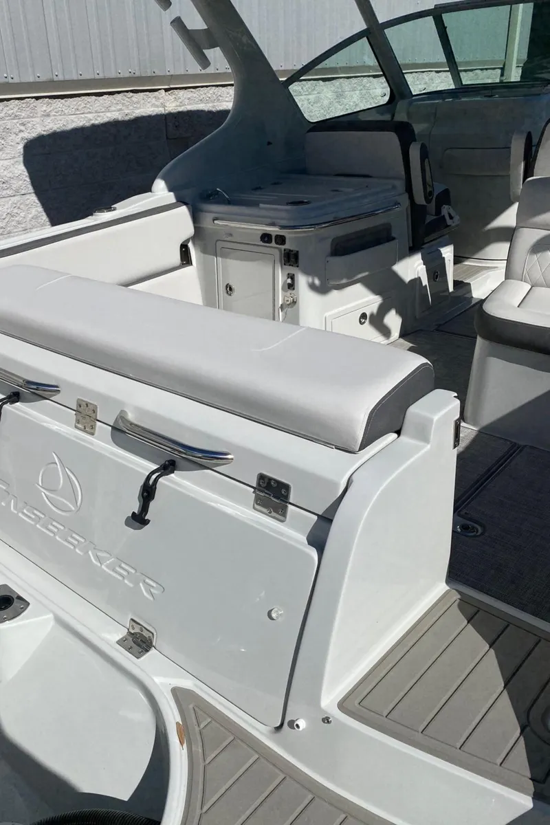Slide: The Image of 2024 Finseeker 280 DC boat interior with seating and storage compartments. - 6