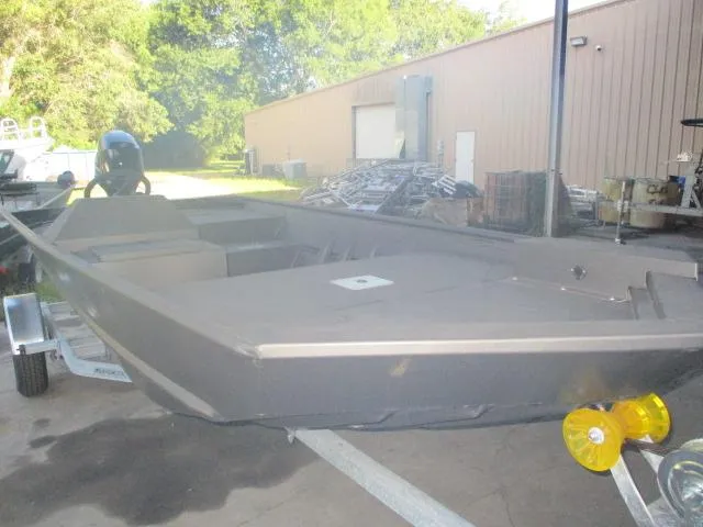 Slide: The Image of 2023 Weldcraft 1652 SPORTSMAN boat on trailer, outdoors near a building. - 2