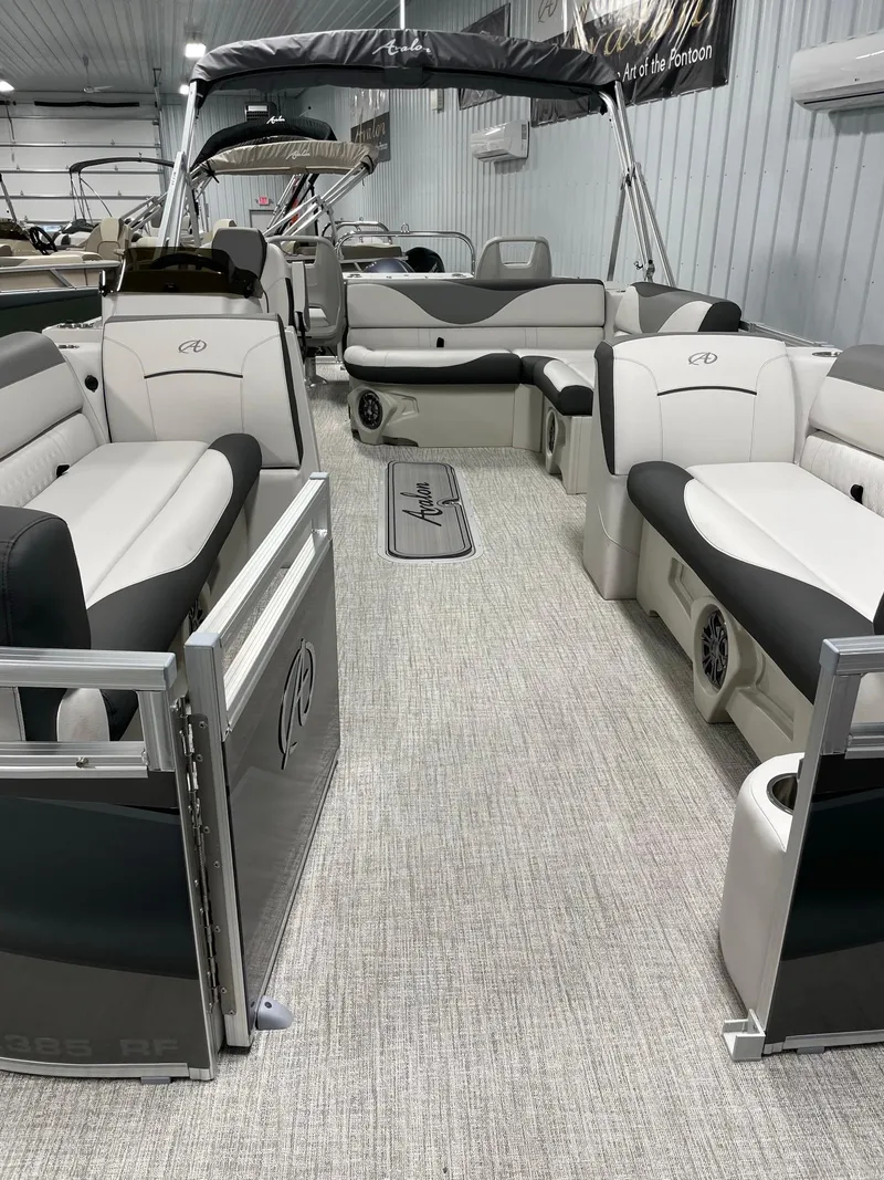 Slide: The Image of 2024 Avalon Venture 85 Rear Fish pontoon boat interior with plush seating. - 10