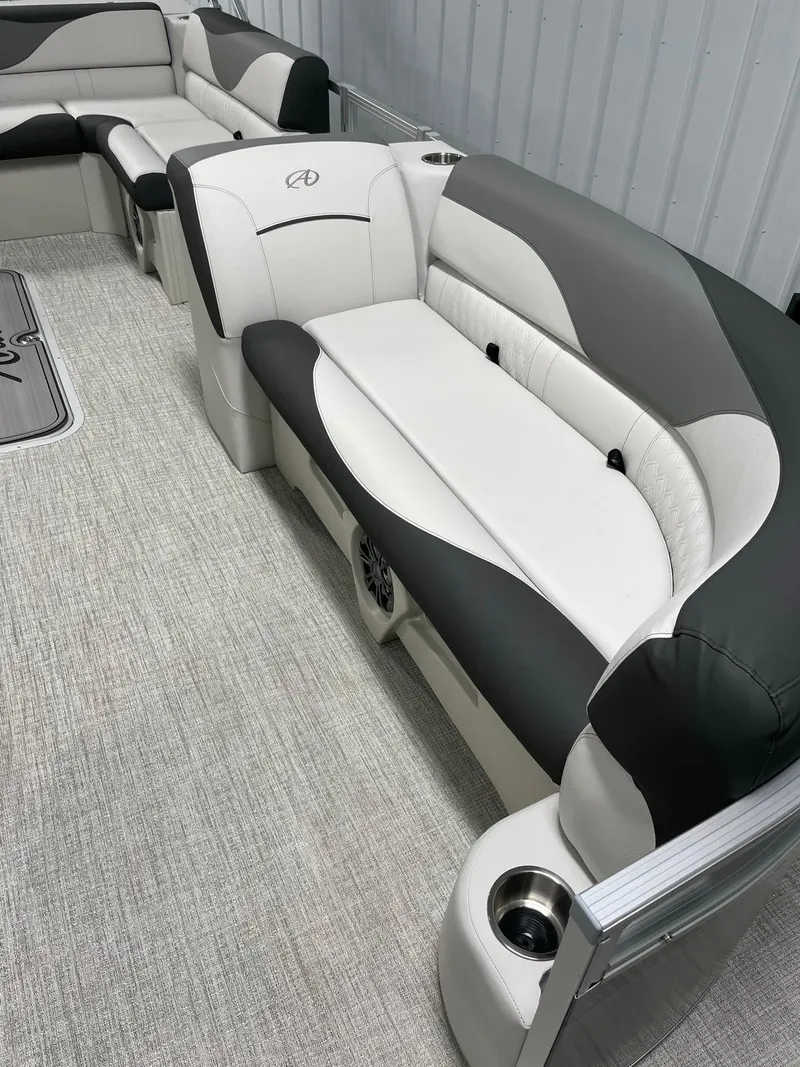 Slide: The Image of 2024 Avalon Venture 85 Rear Fish boat interior with plush seating and cup holders. - 11