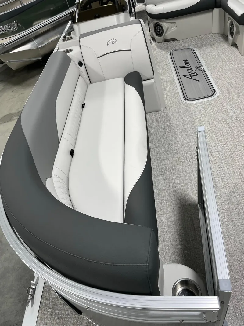 Slide: The Image of 2024 Avalon Venture 85 Rear Fish boat interior with gray and white seating. - 12
